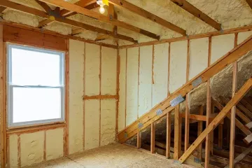 A room at newly constructed home is sprayed with liquid insulating foam